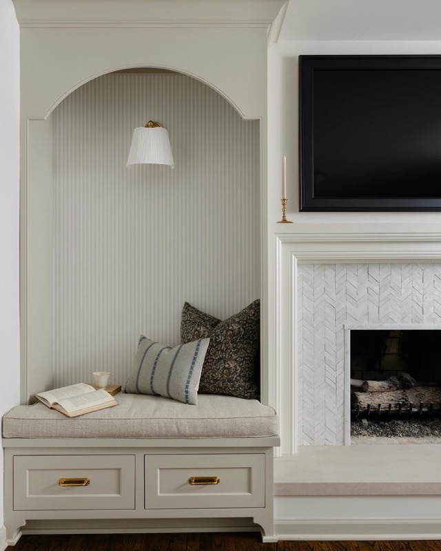 Updated fireplace with cozy reading chair · from the Leah Phillips Interiors studio journal