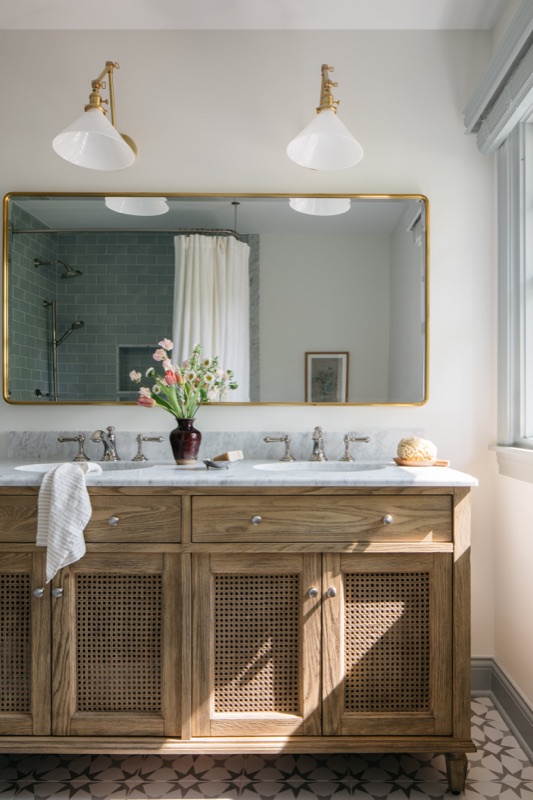 Bathroom with white oak vanity and double brass mirrors designed by Leah Phillips Interiors