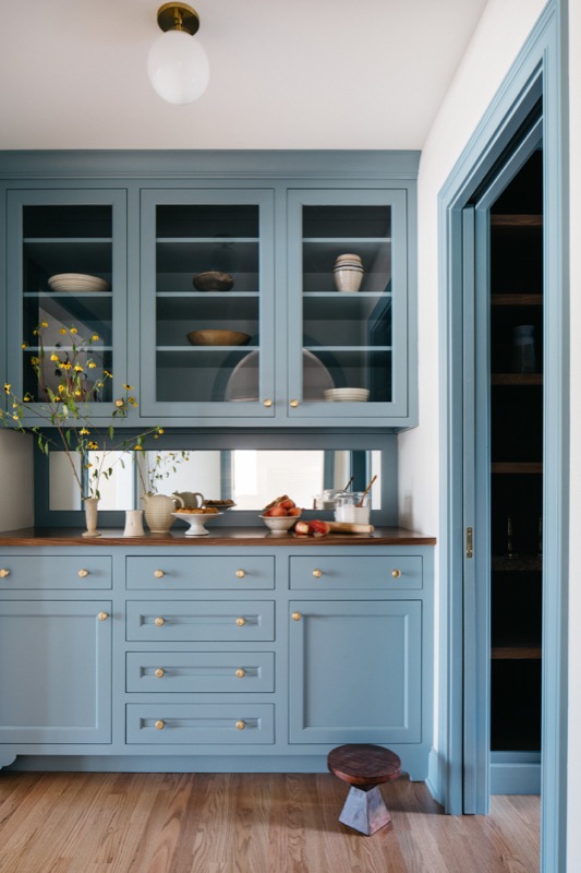 Butler pantry hutch in French blue with glass doors designed by Leah Phillips Interiors