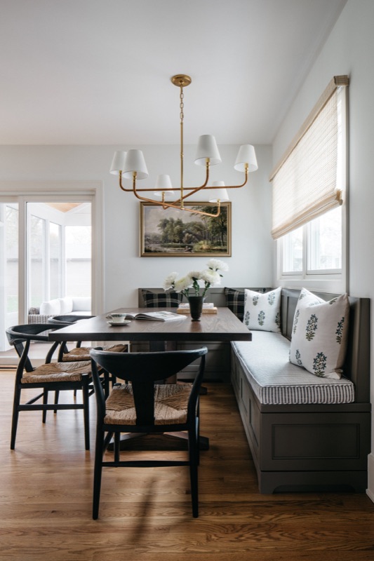 Dining nook with built-in bench and landscape art · Downers Grove Main Level Renovation by Leah Phillips Interiors