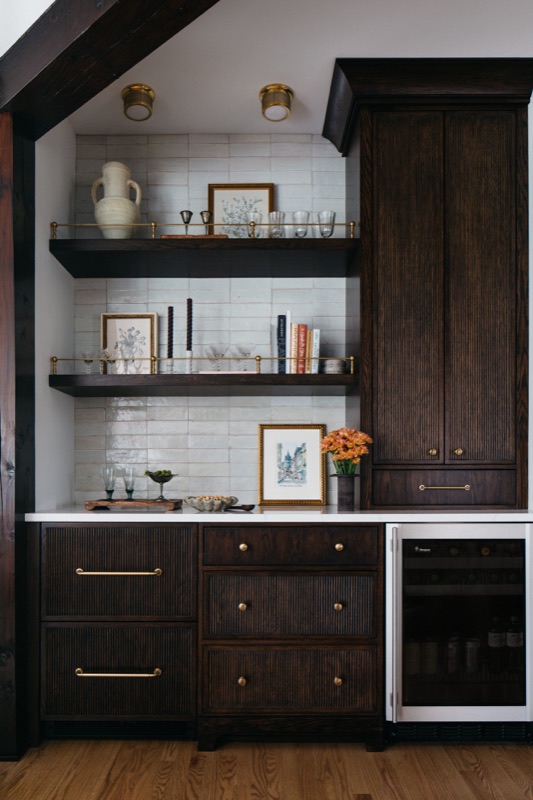 Walnut bar with open shelving and beverage refrigerator · Downers Grove Main Level Renovation by Leah Phillips Interiors