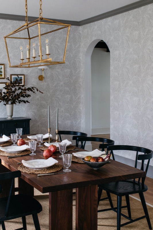 Dining area with wood table and lantern chandelier · Downers Grove Main Level Renovation by Leah Phillips Interiors