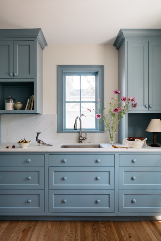 French blue sink wall with marble ledge and brass faucet · Glen Ellyn Kitchen & Bathroom Renovation by Leah Phillips Interiors
