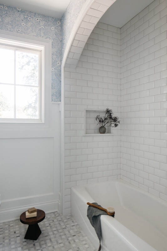 Tub alcove with handmade subway tile and arched ceiling · Glen Ellyn Kitchen & Bathroom Renovation by Leah Phillips Interiors