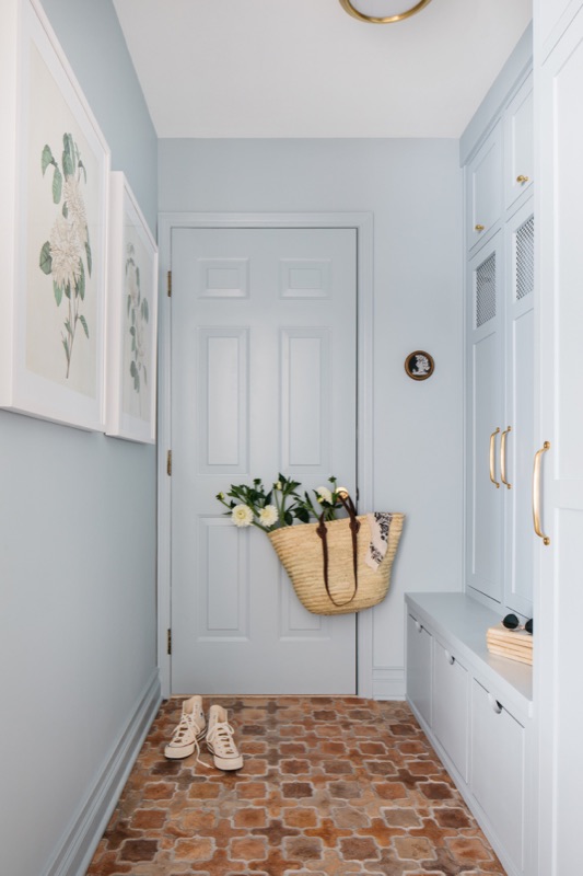 Blue mudroom entry with patterned cement tile · Glen Ellyn Main Level Renovation by Leah Phillips Interiors