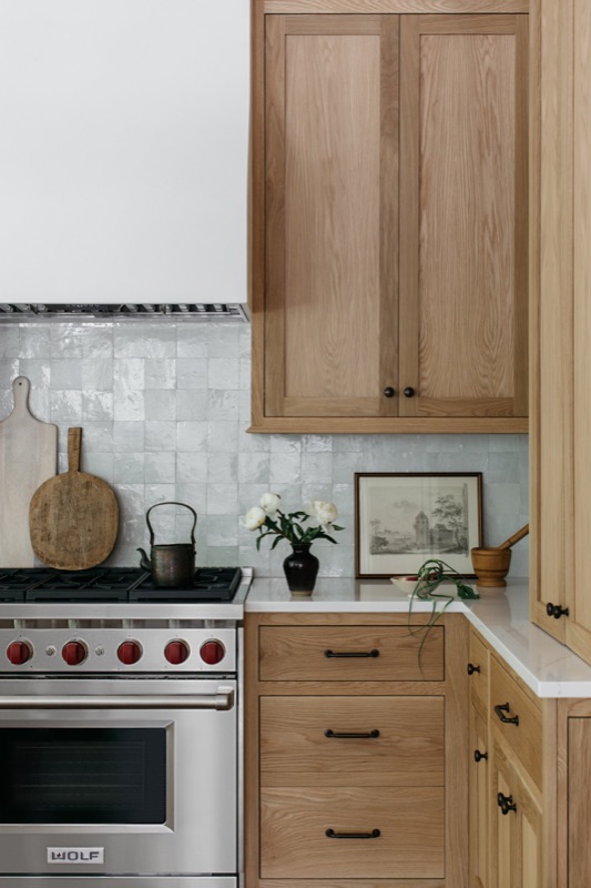 White oak range wall with handmade tile backsplash · Glenview Home Renovation by Leah Phillips Interiors