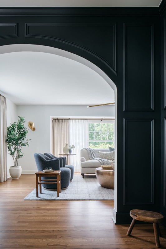 View through the arch from dining room to living room · Glenview Home Renovation by Leah Phillips Interiors