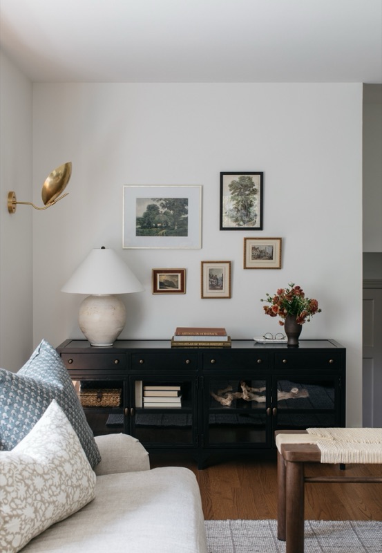 Living room console vignette with gallery art wall · Glenview Home Renovation by Leah Phillips Interiors