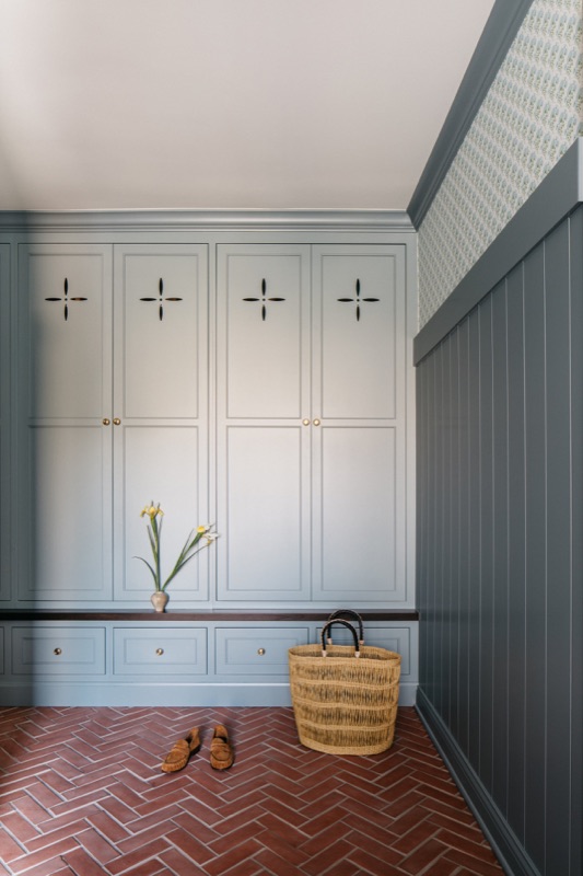 Slate blue mudroom lockers with herringbone brick floor · Glenview Kitchen Addition and Renovation