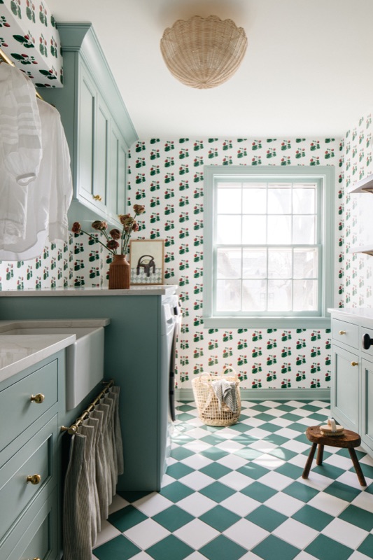 Laundry in sage green with checkerboard floor · Glenview Kitchen Addition & Renovation by Leah Phillips Interiors
