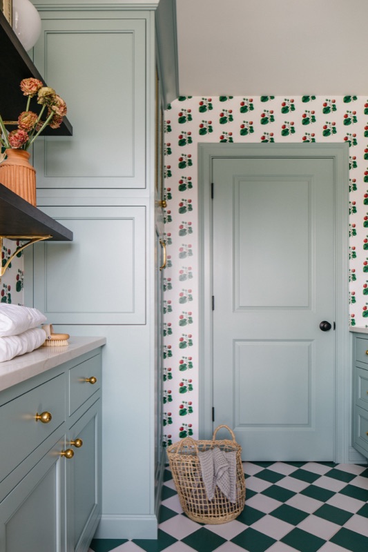 Sage green laundry cabinetry with brass pulls · Glenview Kitchen Addition & Renovation by Leah Phillips Interiors