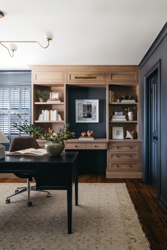 Home office with walnut desk wall and navy paint · Glenview Kitchen Addition & Renovation by Leah Phillips Interiors