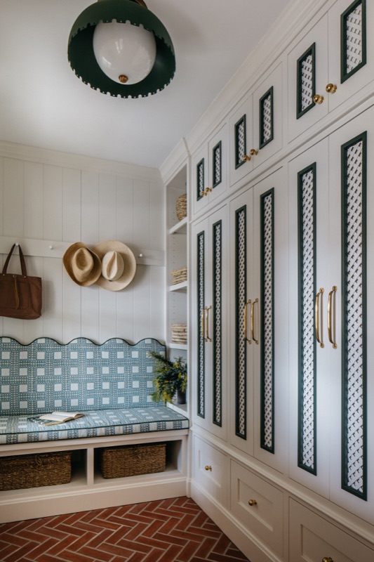 Full mudroom wall of built-in lockers and bench seating · Glenview Main Level Renovation by Leah Phillips Interiors
