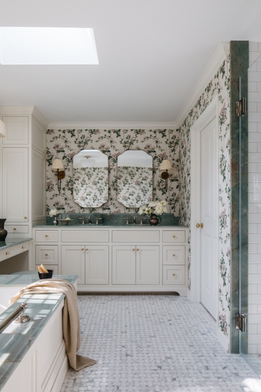Primary bathroom with floral wallpaper and marble mosaic floor · Glenview Main Level Renovation by Leah Phillips Interiors