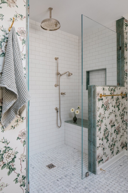 Walk-in shower with zellige tile and floral wallpaper beyond · Glenview Main Level Renovation by Leah Phillips Interiors