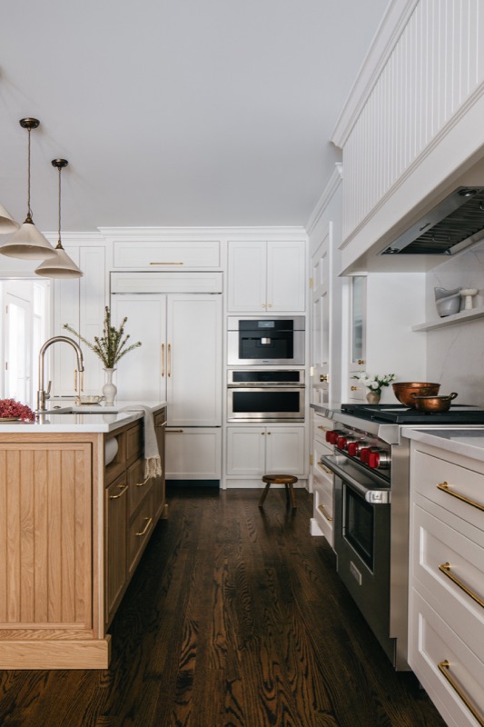 Cream kitchen with white oak island and paneled appliances · Lincoln Park Main Level Renovation by Leah Phillips Interiors