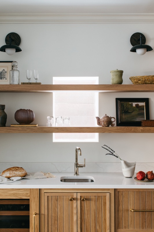 Open oak shelving over the prep sink and beverage center · Lincoln Park Main Level Renovation by Leah Phillips Interiors