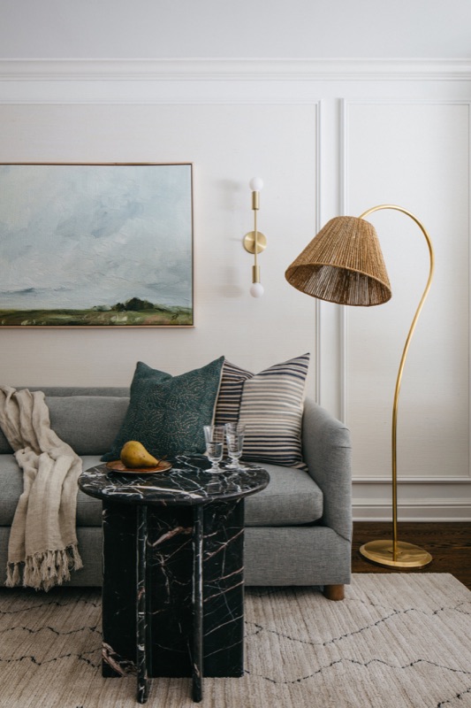 Living room with gray sofa, black marble table and arc lamp · Lincoln Park Main Level Renovation