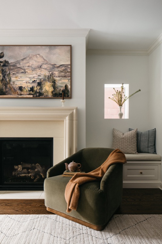 Fireplace corner with olive velvet chair · Lincoln Park Main Level Renovation by Leah Phillips Interiors