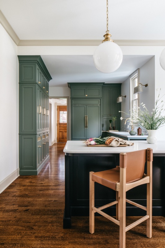 View through the kitchen toward the walnut island · Oak Park Main Level Renovation by Leah Phillips Interiors