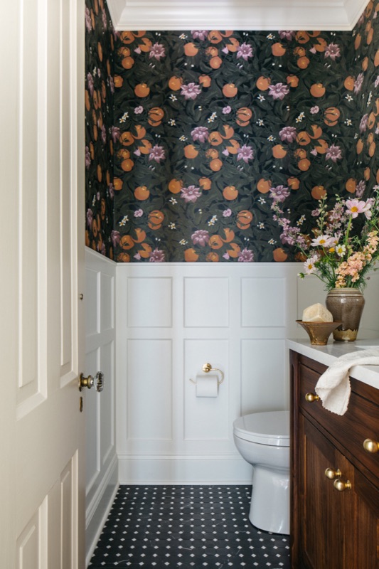 Powder room with dark floral wallpaper and wainscoting · Oak Park Main Level Renovation by Leah Phillips Interiors