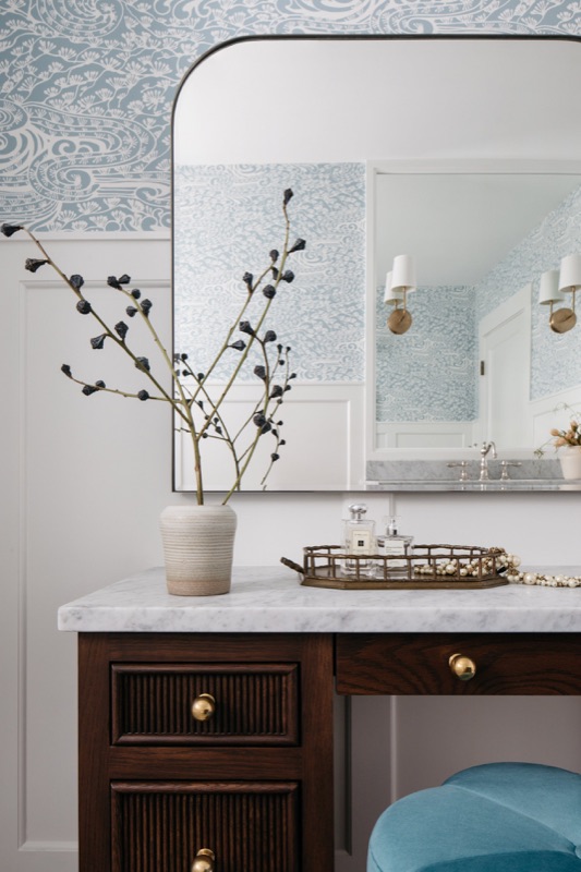 Walnut vanity with white marble top and brass hardware · Wilmette Bathroom & Laundry Renovation by Leah Phillips Interiors