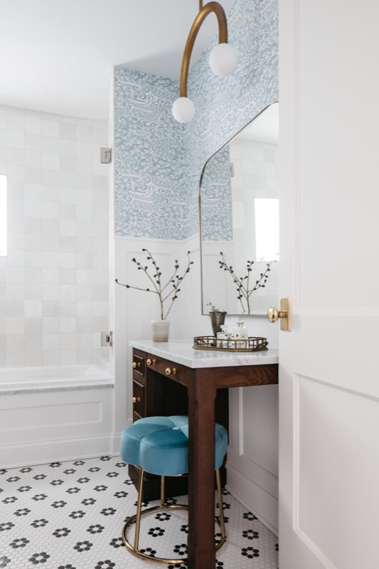 Makeup vanity with teal stool and flower mosaic floor · Wilmette Bathroom and Laundry Renovation