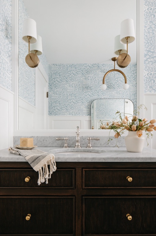 Double brass mirror over the walnut vanity · Wilmette Bathroom & Laundry Renovation by Leah Phillips Interiors