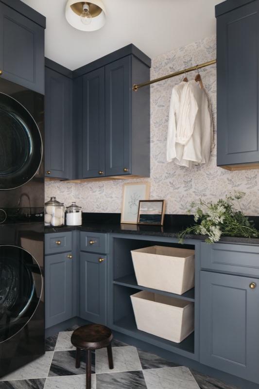 Slate blue laundry with black counters and drying rail · Wilmette Bathroom and Laundry Renovation