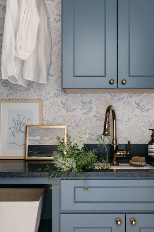 Laundry sink wall with checkerboard marble floor · Wilmette Bathroom & Laundry Renovation by Leah Phillips Interiors