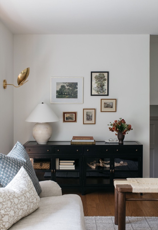 Living room console vignette with black cabinet and art · a recent Glenview transformation by Leah Phillips Interiors