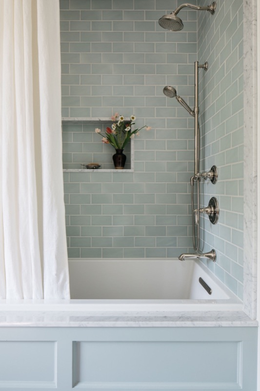 Bathtub with sage green subway tile surround · a recent Glenview transformation by Leah Phillips Interiors